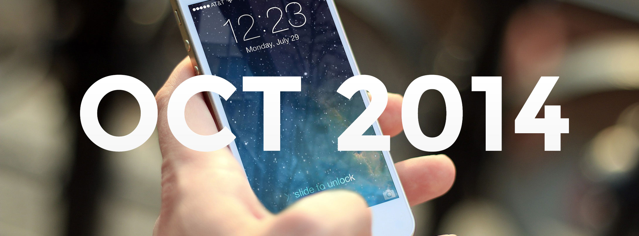 An image of a person holding a phone with OCT 2014 overlaid
